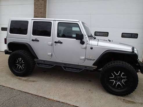 2012 Jeep Wrangler Unlimited 6 cyl, auto, lifted, New 35's - cars &... for sale in Chicopee, NY