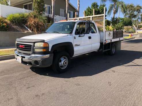 DURAMAX! 2005 GMC Sierra Ext Cab Flatbed - cars & trucks - by owner... for sale in Bonsall, CA