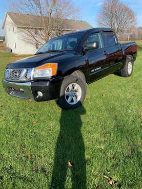 2011 NISSAN TITAN 4X4 - cars & trucks - by owner - vehicle... for sale in Hudsonville, MI