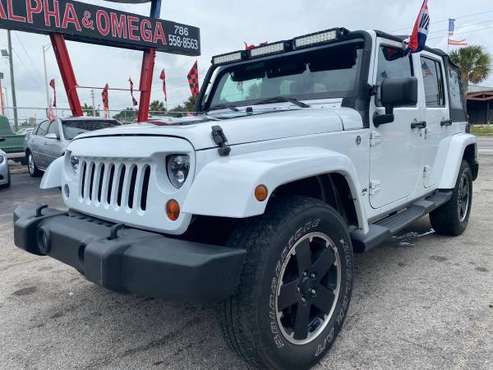 Jeep Wrangler Unlimited Sahara sport 4D 2012 - - by for sale in Miami, FL