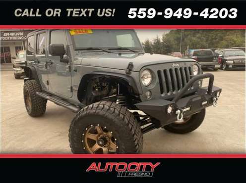 2014 Jeep Wrangler Unlimited Unlimited Sport SUV 4D - cars & trucks... for sale in Fresno, CA
