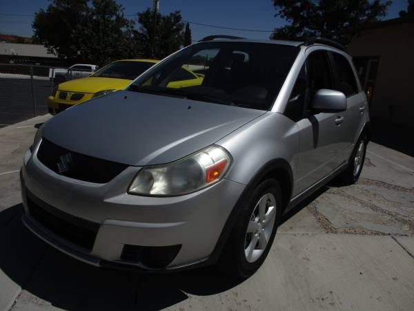 2009 suzuki sx4, awd, manual only 105k miles - cars & trucks - by... for sale in Saint George, UT – photo 2
