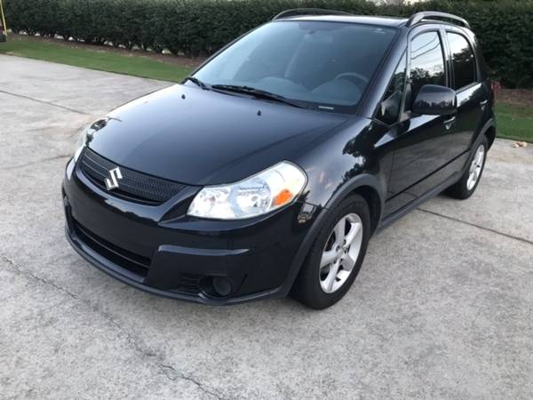 2009 SUZUKI SX4--Clean Solid Car--"One Owner" Priced to Sell - cars... for sale in Buford, GA – photo 2