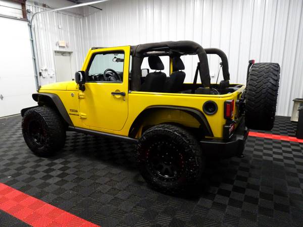 2011 Jeep Wrangler 4WD 2dr Sport hatchback Yellow - cars & trucks -... for sale in Branson West, AR – photo 2
