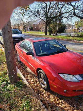 2004 Pontiac Sunfire 2.2L 4cylinder coupe Red - cars & trucks - by... for sale in Dundalk, MD – photo 2