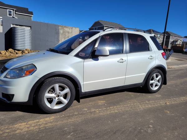 2009 SUZUKI SX4.NICE COMMUTE CAR FOR A STUDENT. LOW MILES - cars &... for sale in Aurora, CO – photo 2