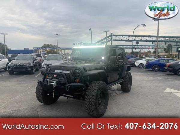 2012 Jeep Wrangler Unlimited Sahara 4WD - cars & trucks - by dealer... for sale in Orlando, FL